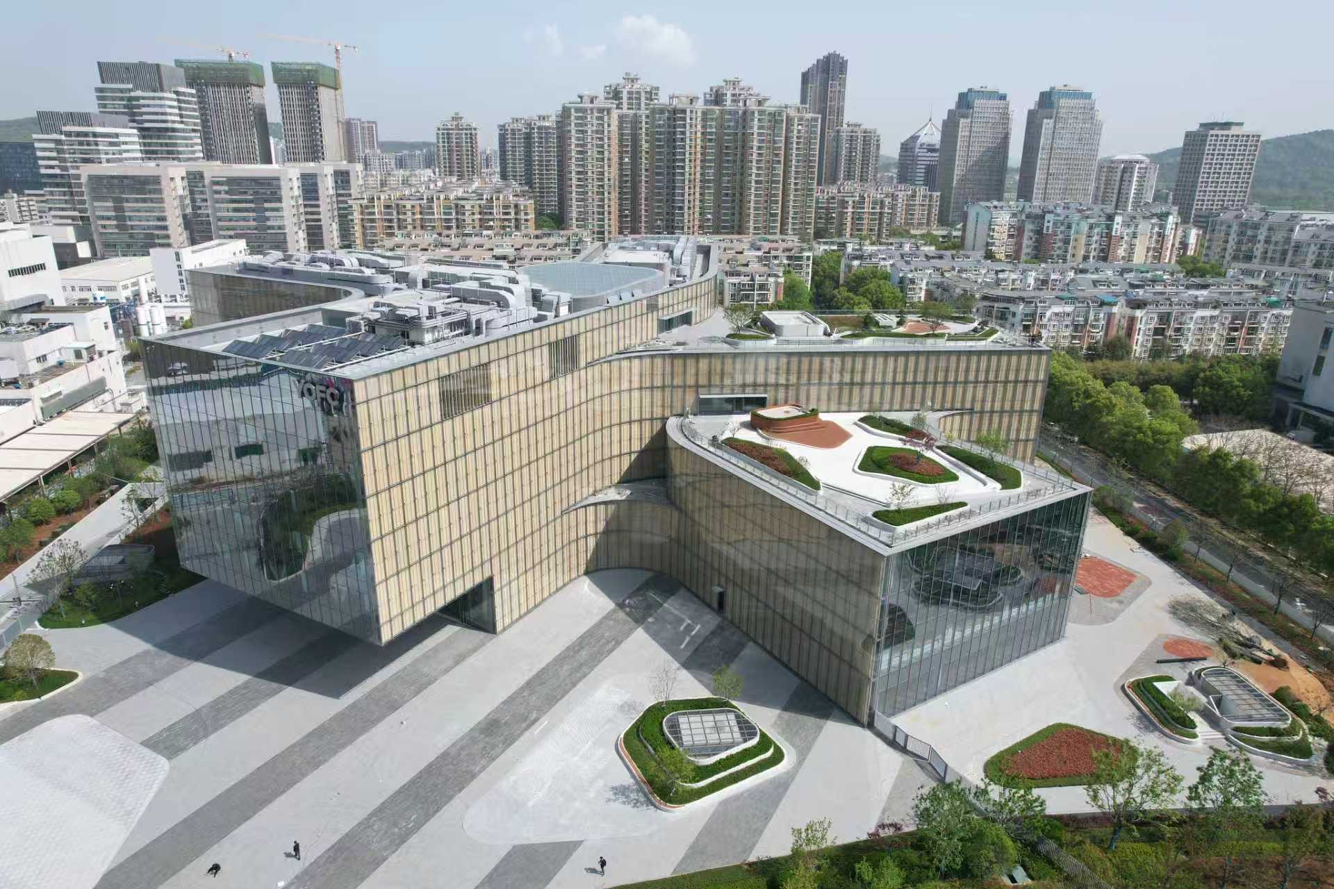 Aerial view of a large commercial building with an extensive glazed façade